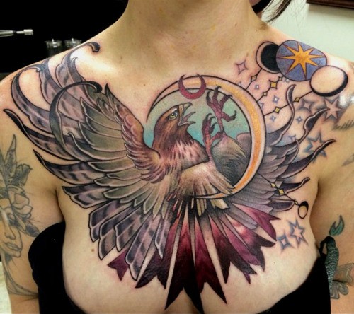 Big multicolored flying eagle tattoo on chest with moon and stars