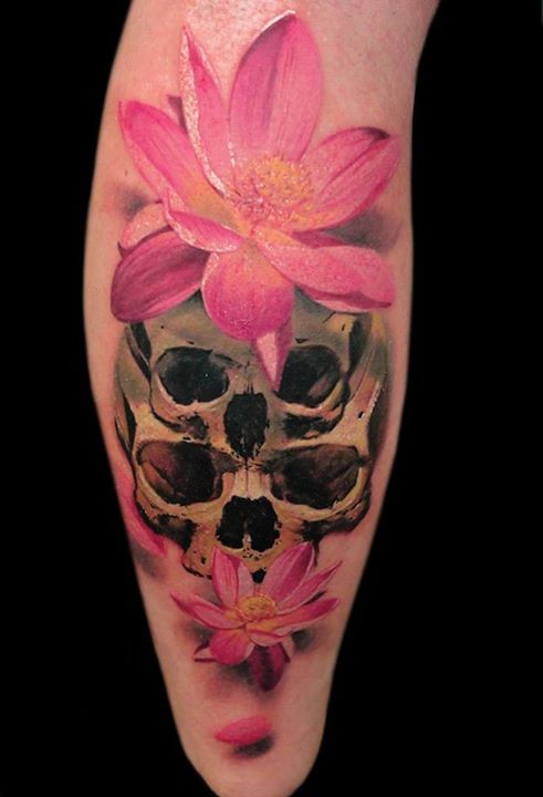Big multicolored leg tattoo of human skulls with beautiful 3D flowers