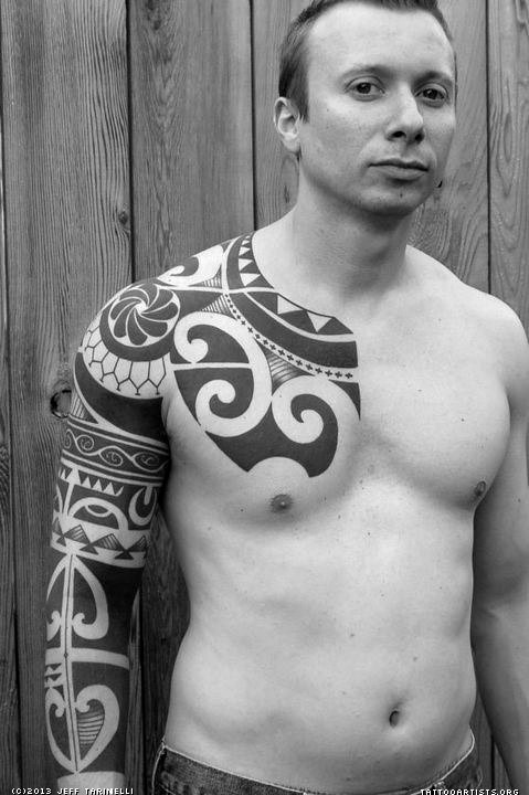 Big mystical black and white Polynesian ornaments tattoo on sleeve and chest