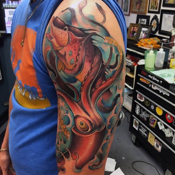 Big natural looking colored squid shoulder tattoo with fish
