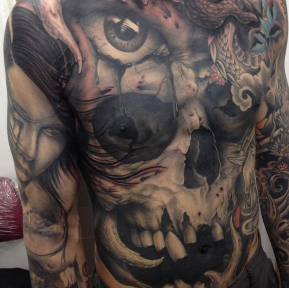 Big new school style chest and belly tattoo of human skull with dragon and eye