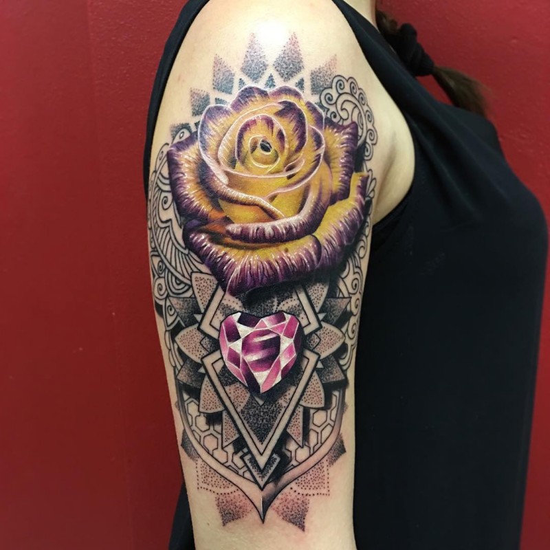 Big original combined illustrative style rose tattoo on shoulder with ornamental style figures
