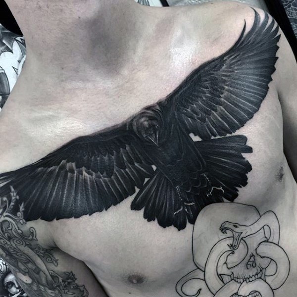 Big realistic black ink detailed crow tattoo on chest