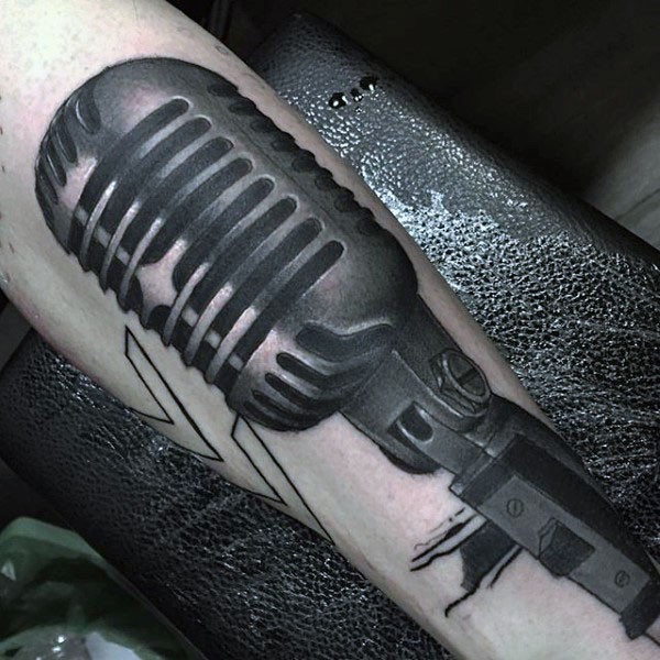 Big realistic looking black and white vintage microphone tattoo on leg