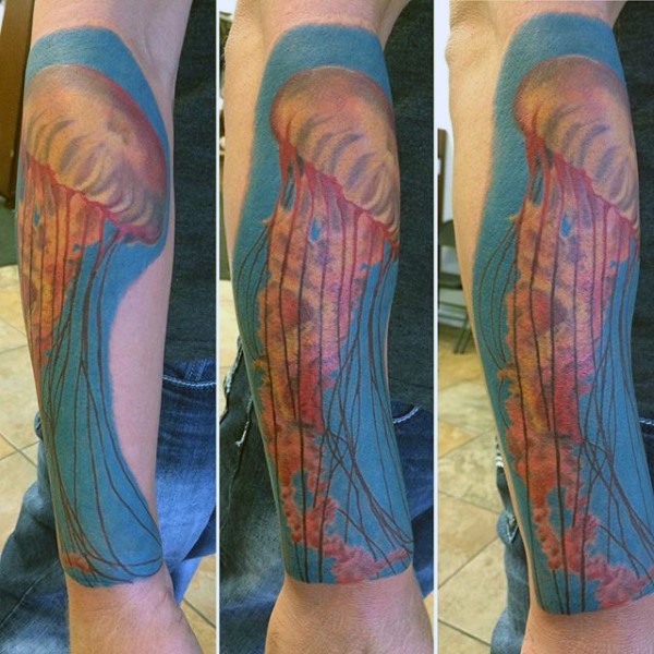 Big realistic painted and colored big jellyfish tattoo on arm