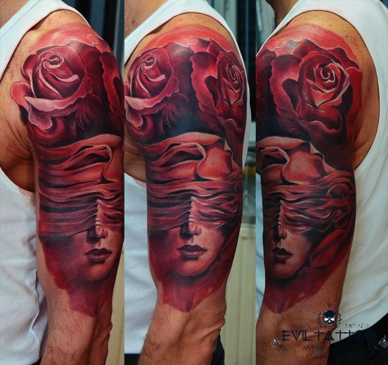 Big red ink style shoulder tattoo of woman face with roses