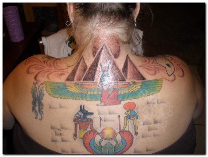 Big simple designed and colored upper back tattoo of various Egypt symbols