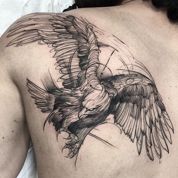 Big size flying detailed black crow tattoo on back in engraving style