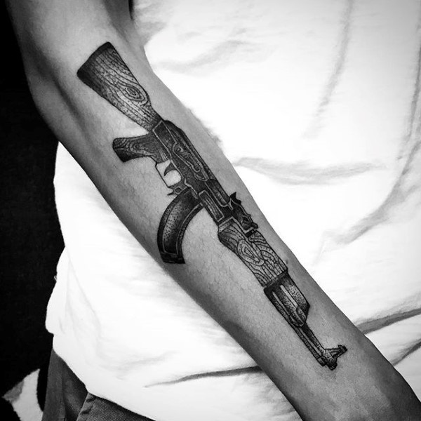Big stippling style arm tattoo of cool AK rifle