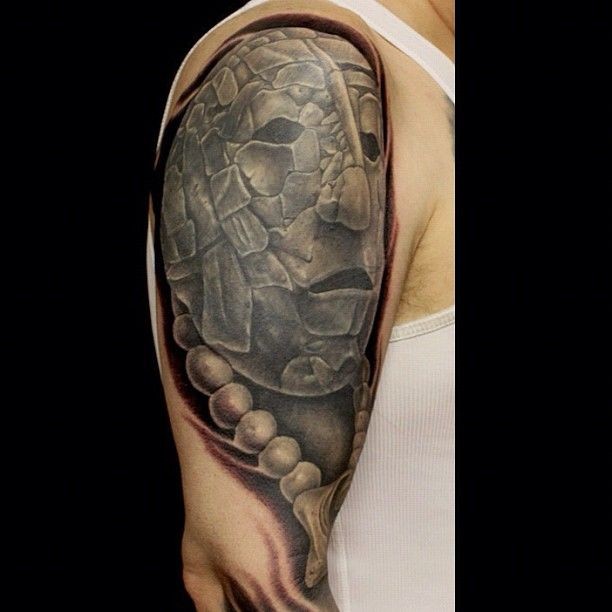 Big stonework style shoulder tattoo of ancient statue