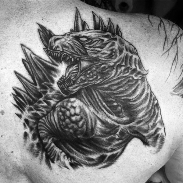 Big very detailed black ink Godzilla tattoo on shoulder