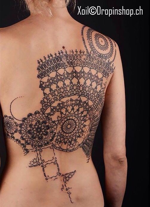 Big very detailed whole back tattoo of impressive and detailed ornaments