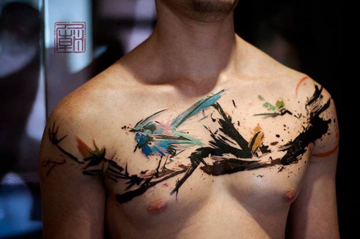 Bird tattoo on chest from designer