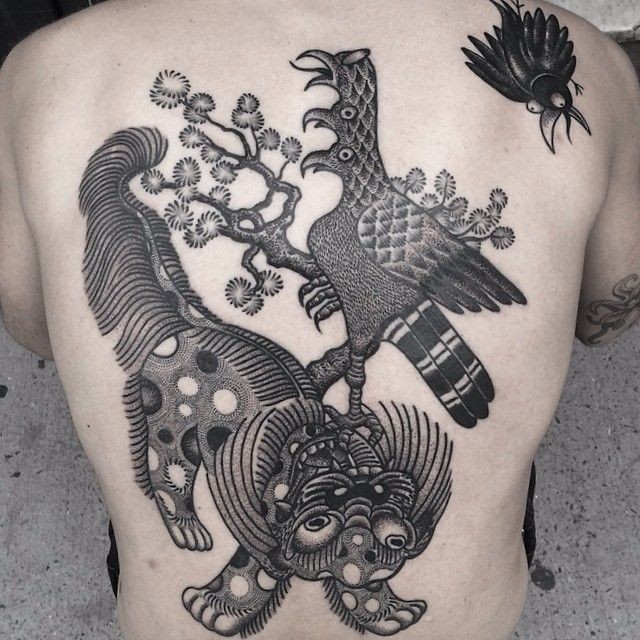 Black and gray birds and fantastic animal tattoo on back