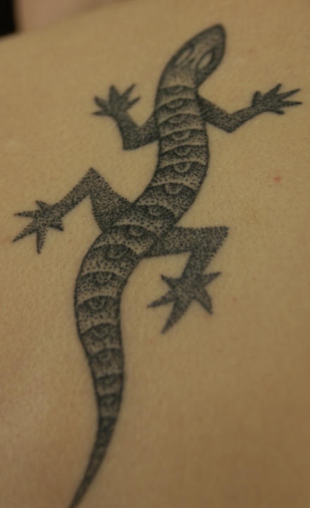 Black and gray crawling lizard tattoo