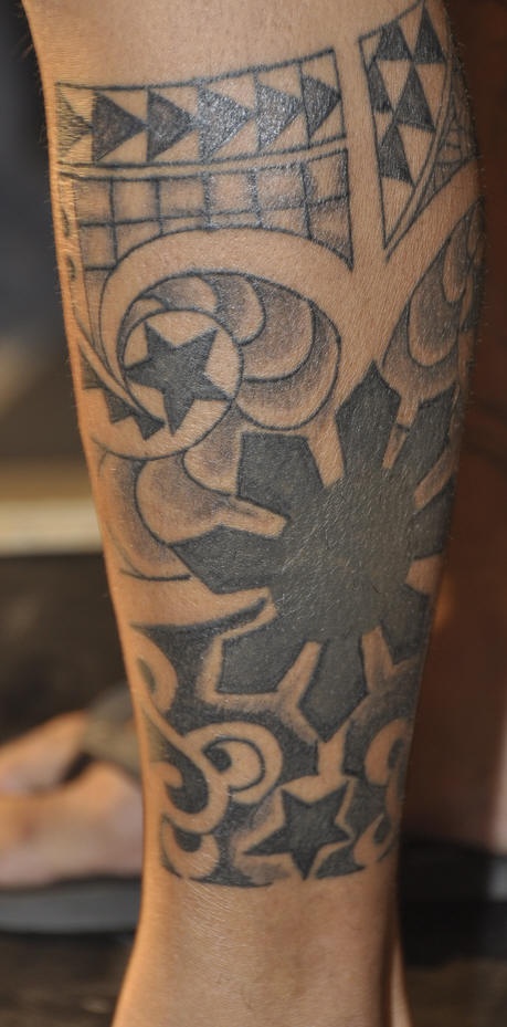 Black and gray leg tattoo with pattern