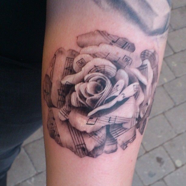 Black and gray rose from note of sheets tattoo
