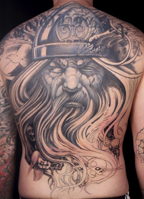 Black and gray scandinavian god tattoo on back