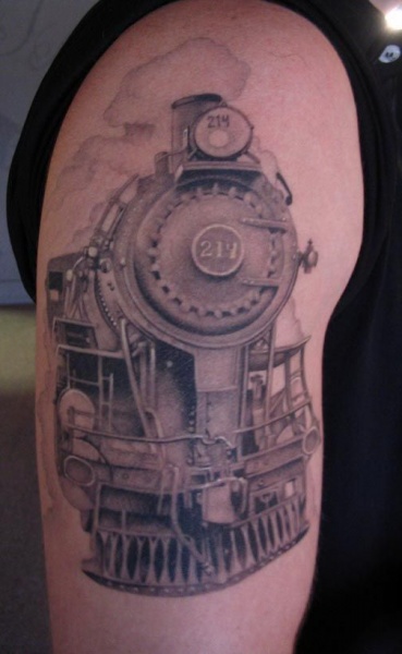 Black and gray style accurate painted upper arm tattoo of train