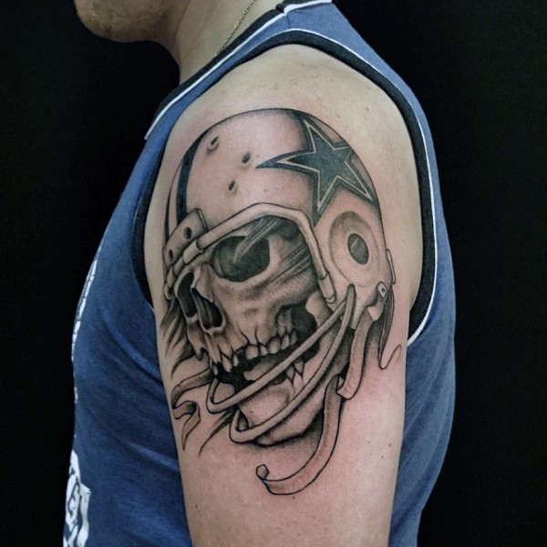 Black and gray style amazing looking shoulder tattoo of American player skeleton with helmet
