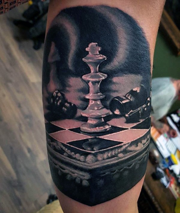 Black and gray style amazing looking biceps tattoo of chess board with figures