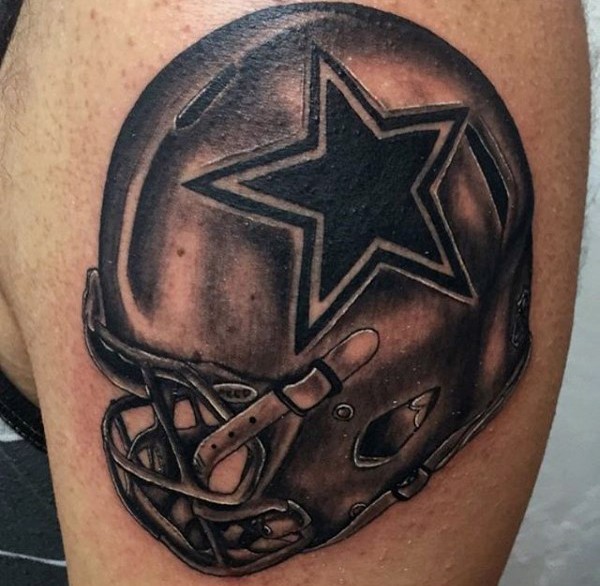 Black and gray style awesome looking shoulder tattoo of American football helmet