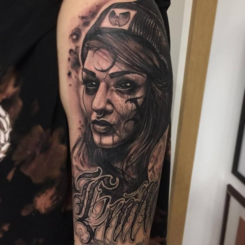 Black and gray style big forearm tattoo of mystical woman face with lettering
