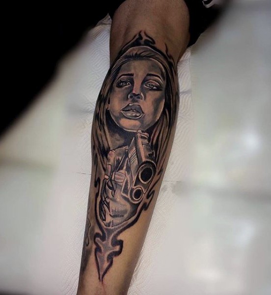 Black and gray style black ink forearm tattoo of woman with pistol