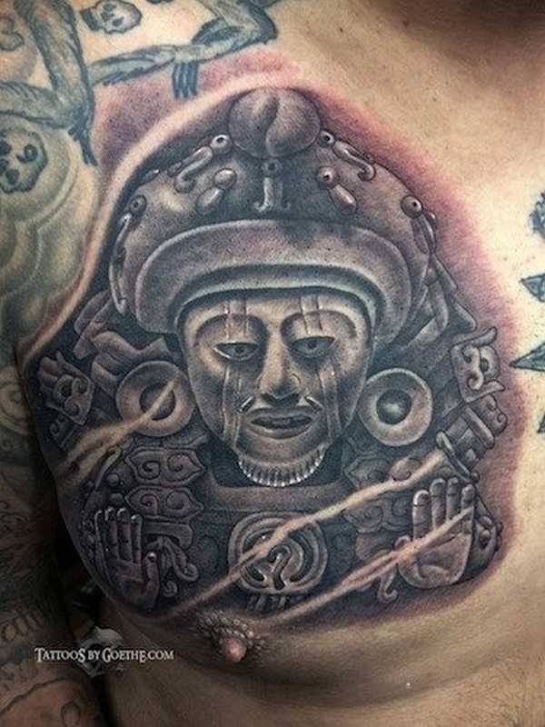 Black and gray style chest tattoo of ancient stone statue