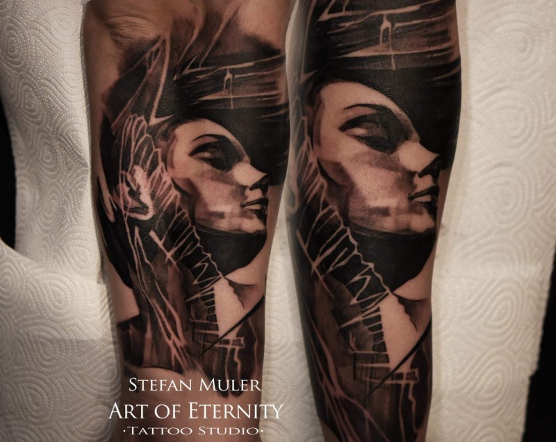 Black and gray style colored arm tattoo of woman portrait