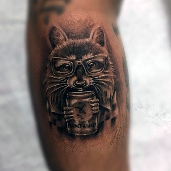 Black and gray style colored arm tattoo of raccoon with glasses and can