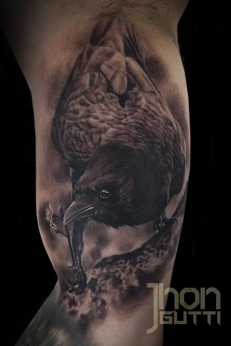 Black and gray style colored biceps tattoo of detailed crow