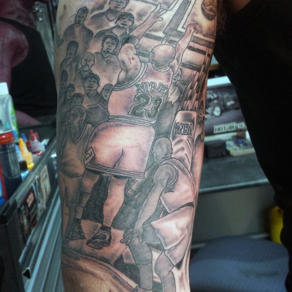 Black and gray style colored forearm tattoo of various basketball players