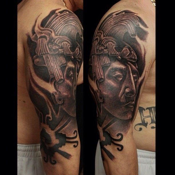 Black and gray style colored shoulder tattoo of antic statue