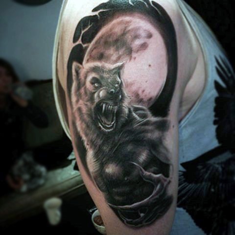 Black and gray style colored shoulder tattoo of werewolf and large moon