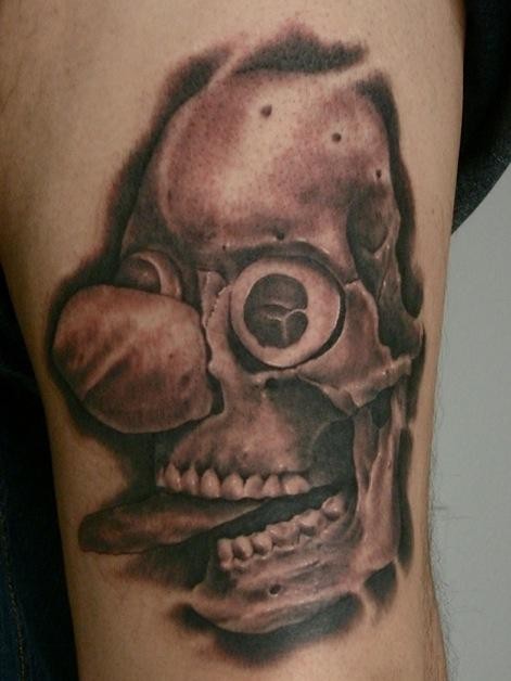 Black and gray style creepy looking tattoo of demonic clown skull