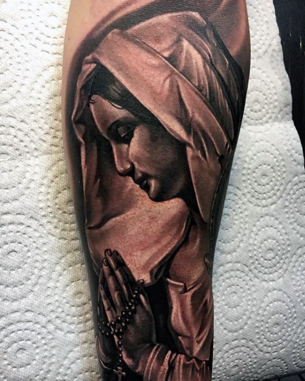 Black and gray style detailed arm tattoo of woman in hood