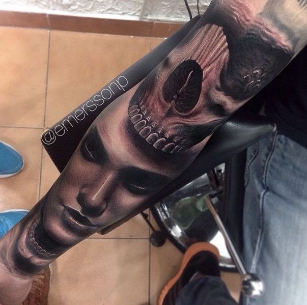 Black and gray style detailed arm tattoo of demonic skull with woman face
