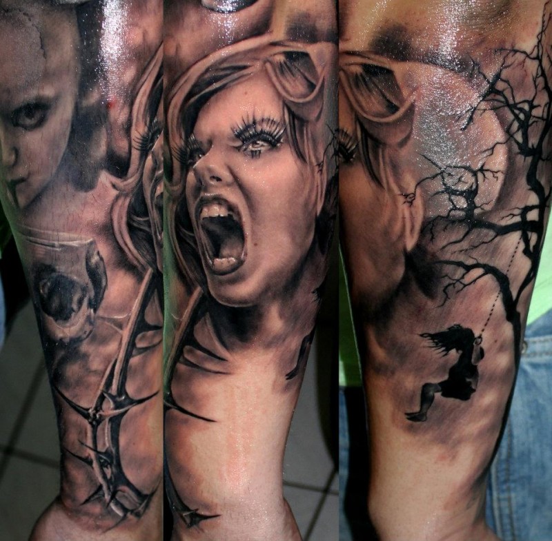 Black and gray style detailed arm tattoo of screaming woman with vine and dark tree