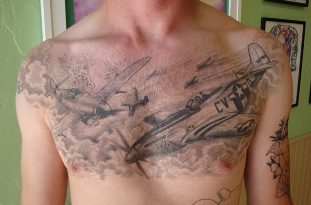 Black and gray style detailed chest tattoo of WW2 fighter planes