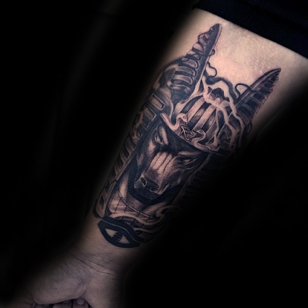 Black and gray style detailed forearm tattoo ancient Egypt God statue