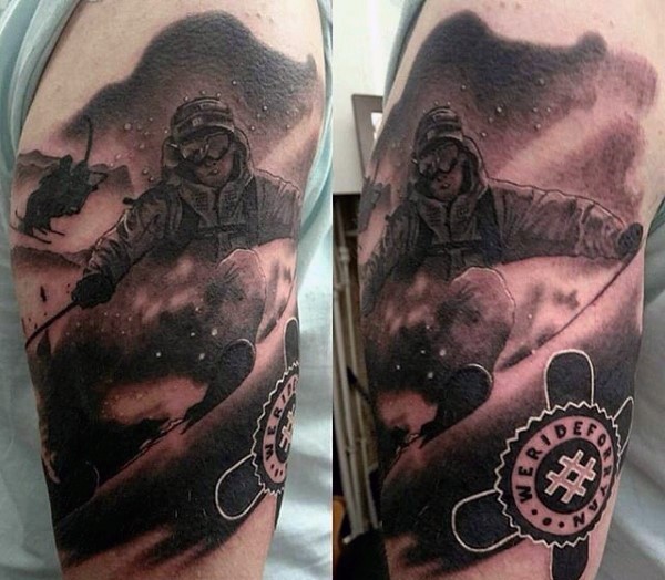 Black and gray style detailed shoulder tattoo of man with snowboard