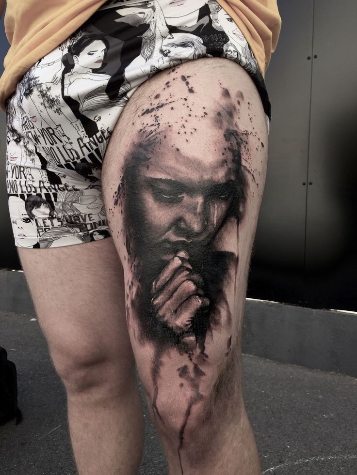 Black and gray style detailed thigh tattoo of praying woman