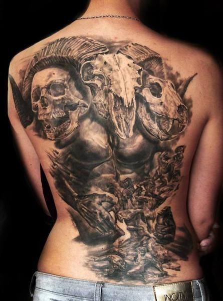 Black and gray style detailed whole back tattoo of creepy demon with goats and animal skulls