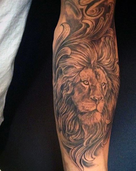 Black and gray style forearm tattoo of lion head