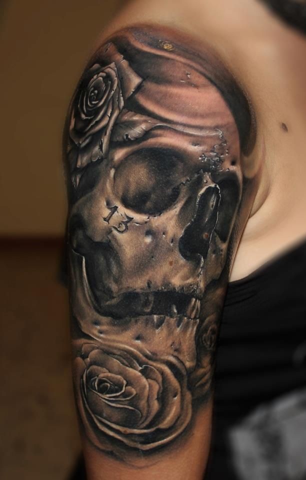 Black and gray style human skull with rose and number