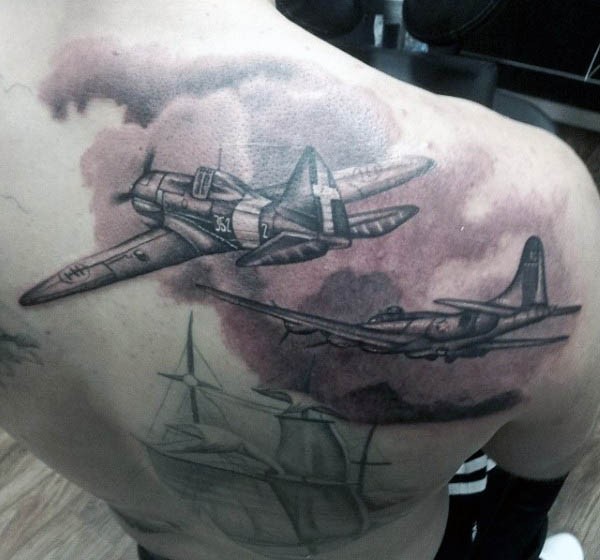 Black and gray style incredible looking shoulder tattoo of old military planes