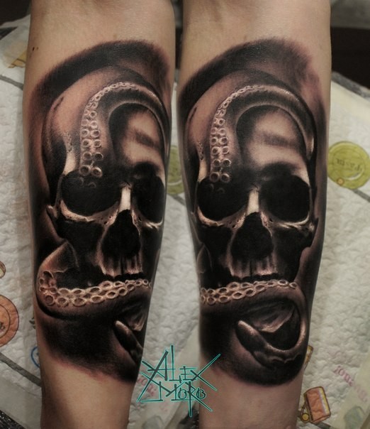 Black and gray style medium size forearm tattoo of human skull with octopus