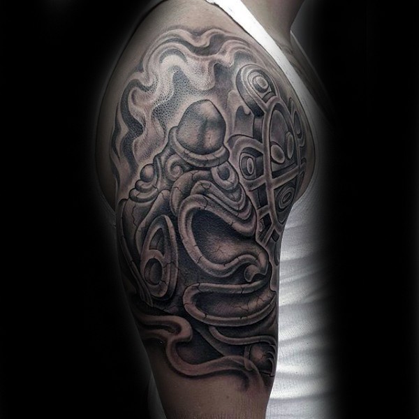 Black and gray style shoulder tattoo of stone like statue