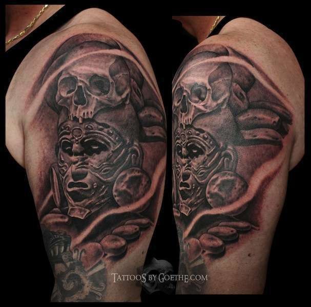 Black and gray style shoulder tattoo of ancient tribe warrior with skull